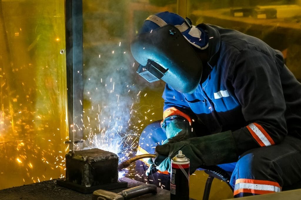 Why do welders wear pearl snaps?